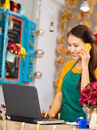 Flower girl taking an order on phone